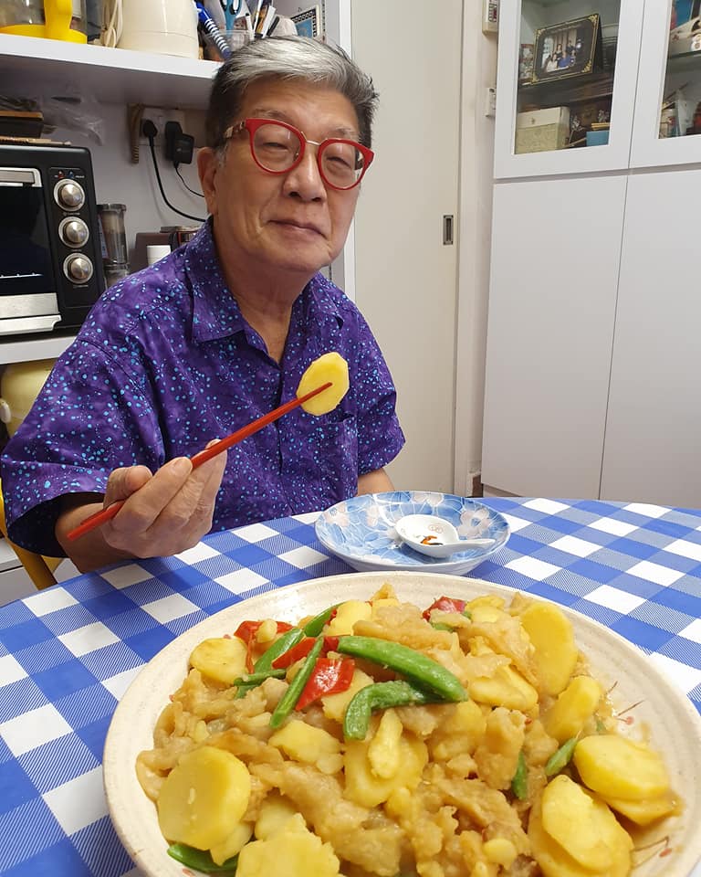 My Samurai enjoys eating the Potato, Fish Maws, Sweet Peas dish I cooked