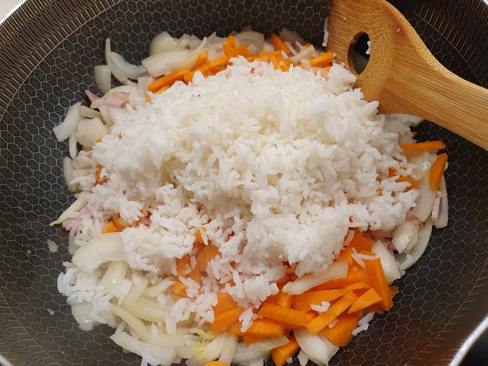 Add in the cooked Rice and Carrot to mix in to stir fry. 
